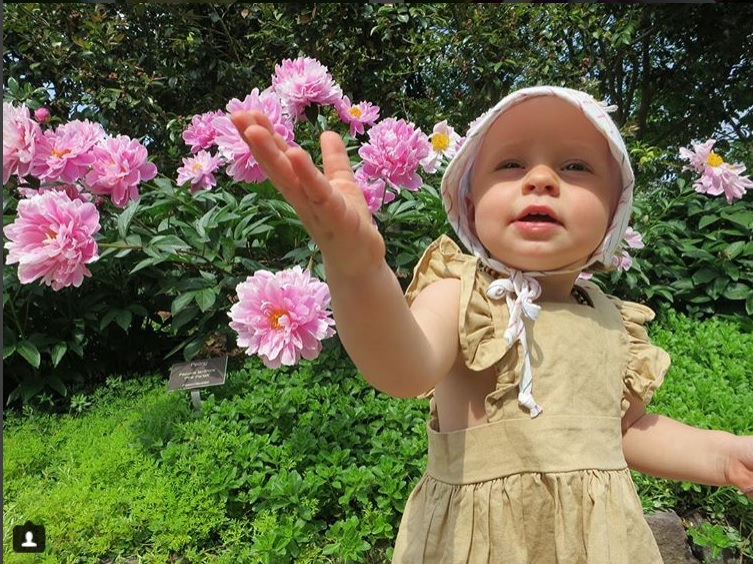 Girl with peony flowers, the #MillionBlooms contest winner